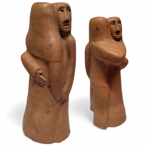 558 - Mid 20th Century Design - 'A Couples Embrace' abstract terracotta sculpture, signed BAÉ, 36cm high