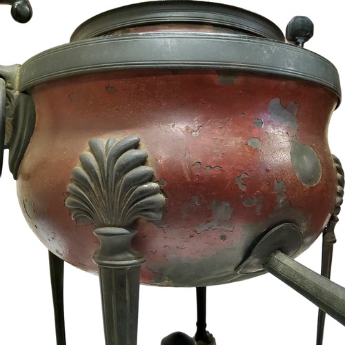 373 - A Regency Empire samovar, twin loop carrying handles raised on anthemion capped fluted supports term... 