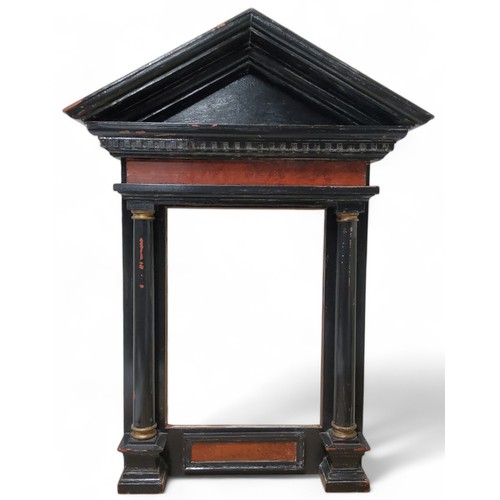 675 - A Grand Tour aedicular, or tabernacle ebonised frame, Doric column supports, inner measurements 47cm... 