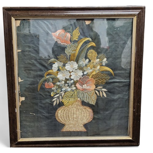 308 - A 19th century needlework sampler, embroidered in silk with a vase of flowers, 54cm x 51cm