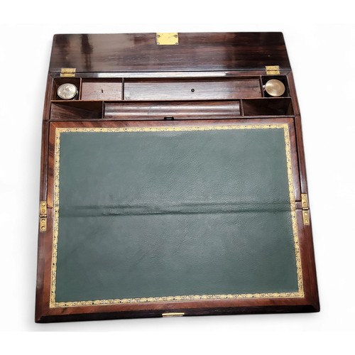 396 - A Victorian rosewood sloped rectangular writing box, inlaid with mother of pearl escutcheon and cart... 