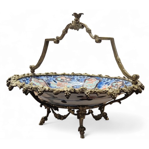 243 - A Japanese Imari and gilt metal comport, the dish decorated in the typical palette, the mounts with ... 