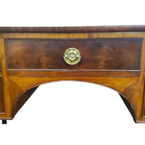 664 - A George III flamed mahogany dressing table, central cockbeaded drawer, two blind drawers to left, c... 