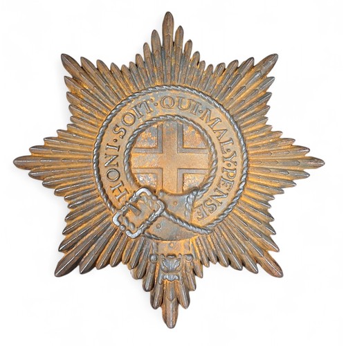 559 - Militaria - a cast iron possibly an officer's mess wall plaque of a Coldstream Guards cap badge, 32c... 