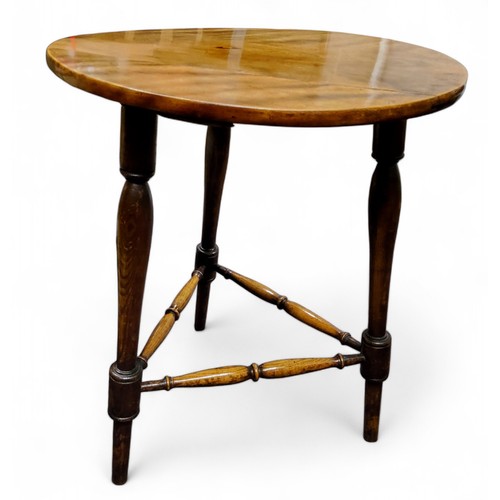 306 - A '19th century' mahogany cricket table, circular top, turned legs and stretchers, 56cm diam, 68cm h... 