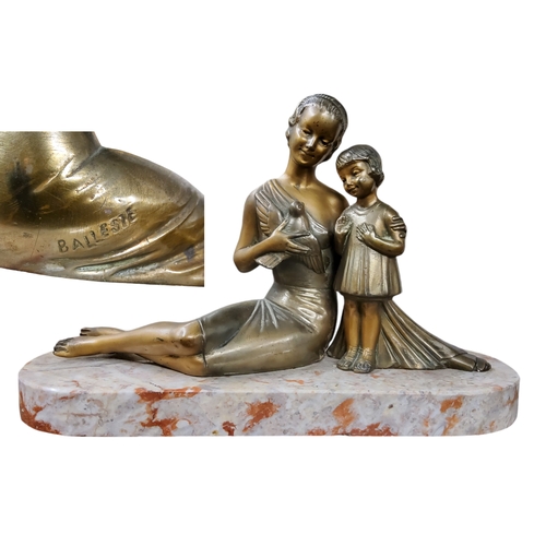 522 - French School, Art Deco,  after H Balleste, a parcel gilt bronze, of a seated lady holding a swallow... 