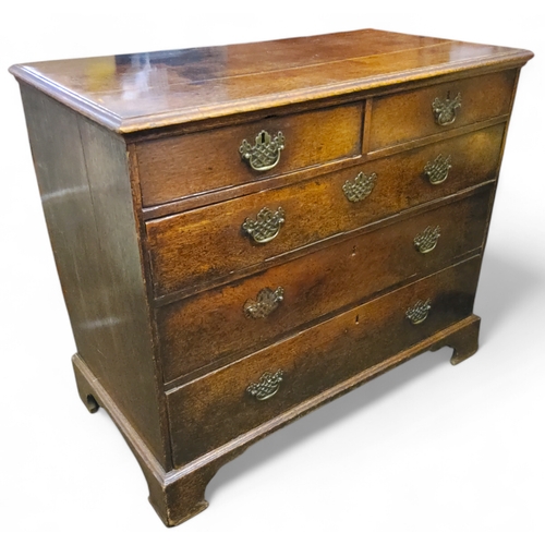 669 - A George III oak secretaire chest,  two short over three long drawers, bracket feet, 90cm x 107cm x ... 