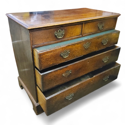 669 - A George III oak secretaire chest,  two short over three long drawers, bracket feet, 90cm x 107cm x ... 