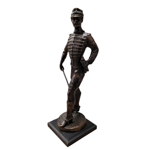 521 - French School, 20th century, a dark patinated bronze, iof a French Cavalry Officer, standing, 36.5cm... 