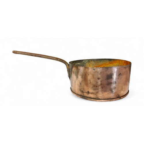 686 - A large Victorian copper saucepan, steel handle, 29cm diam, c.1860