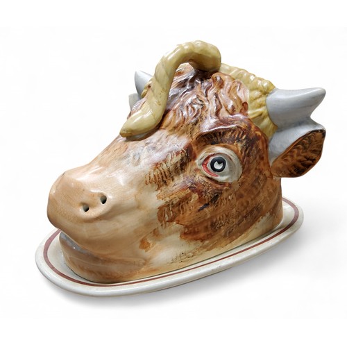 70 - A Staffordshire novelty cheese dish, the cover as the head of a bull, 25.5cm wide, c.1880