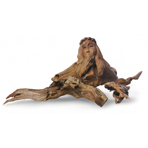 682 - A large driftwood carving, Neptune, head and shoulders, 34cm high, 42cm wide; other driftwood (3)