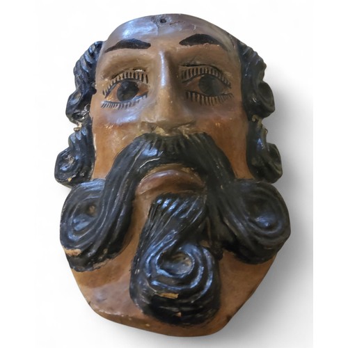 345 - A Latin America/Mexico polychrome wood mask, carved with mustache and beard, 26cm high, 19th century