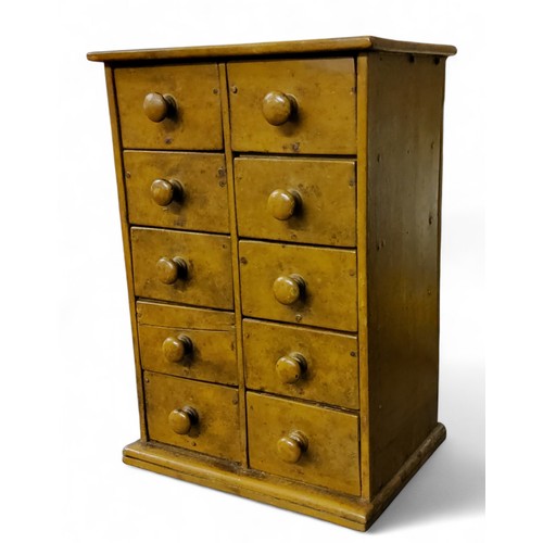 562 - Miniature Furniture - a chest, of two rows of five drawers, 21cm high, 15cm wide, c.1860