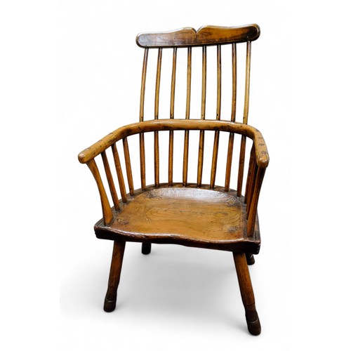 690 - A late 18th century primitive comb-back Windsor chair, of West Country design,  shaped cresting rail... 