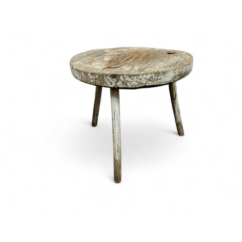 426 - An 18th century rustic cricket table, circular top, white painted, 59cm high, 52cm diam