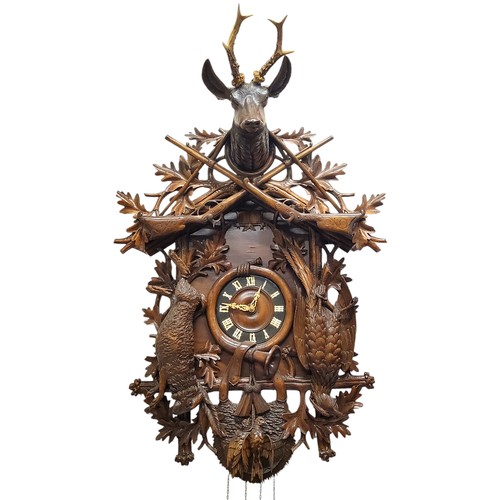 655 - A fine 19th century Black Forest carved limewood spring driven cuckoo clock, Jagdstück/hunt piece, t... 