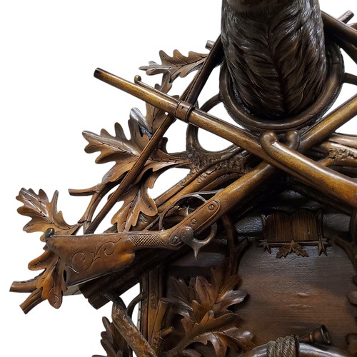 655 - A fine 19th century Black Forest carved limewood spring driven cuckoo clock, Jagdstück/hunt piece, t... 