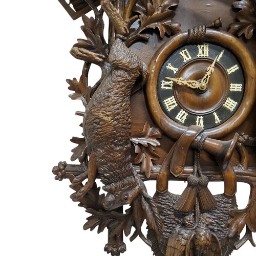 655 - A fine 19th century Black Forest carved limewood spring driven cuckoo clock, Jagdstück/hunt piece, t... 