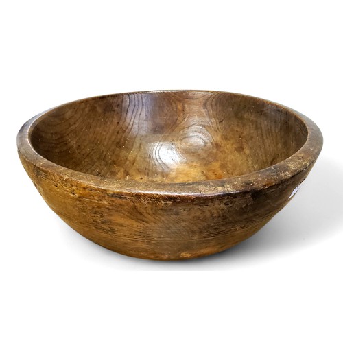 680 - A large 19th century elm dairy bowl, incised banded decoration to exterior, 14.5cm high, 35.5cm diam... 