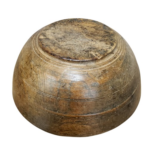 680 - A large 19th century elm dairy bowl, incised banded decoration to exterior, 14.5cm high, 35.5cm diam... 