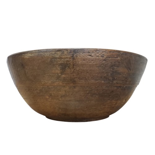 680 - A large 19th century elm dairy bowl, incised banded decoration to exterior, 14.5cm high, 35.5cm diam... 