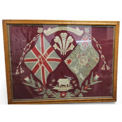 617 - World War I - an early 20th century woolwork for Royal Welch Fusiliers, with crossed regimental flag... 