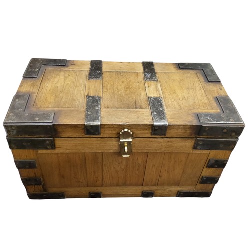 445 - An early 20th century American iron bound silver chest, bold bronze carrying handles and lock plate,... 