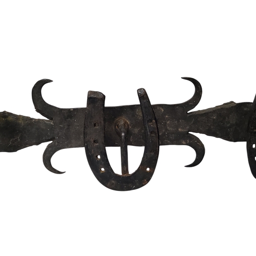 499 - Equestrian interest - a 19th century wrought iron tap room coat rack, applied horse shoe hooks, 15cm... 