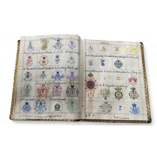 534 - Heraldry - a 19th century scrap book of Arms, Crests and Monograms, various subjects including milit... 