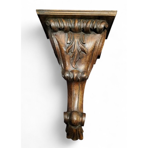 310 - A 19th century oak wall bracket, carved with leafy scrolls, 39cm high, c.1860