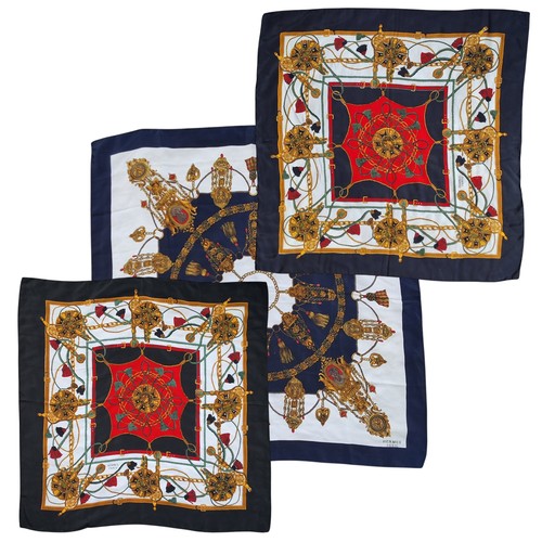 603 - A vintage classic Hermes silk scarves,  in tones of black, gold, green and red, black border, signed... 