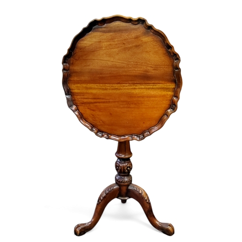 628 - A Chippendale Revival mahogany pie crust occasional table, tilt top, birdcage action, acanthus cappe... 