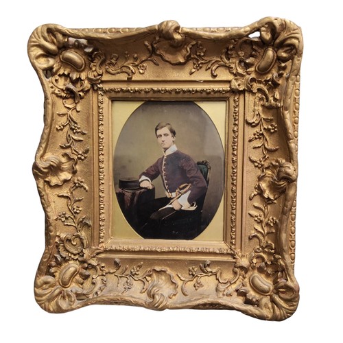 311 - A 19th century photograph, of a French military officer, seated, oval, gilt foliate scroll frame, 35... 