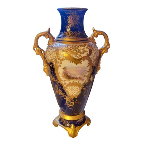 87 - A Coalport two handled ovoid vase and cover,  painted with a landscape within a gilt scroll cartouch... 