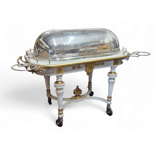 633 - A large and impressive E.P.N.S. meat carving trolley, domed retracting cover engraved with oval cart... 