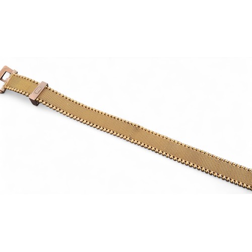 55 - A 9ct gold bracelet in the form of a belt, the mesh bracelet bordered by beads, rose gold buckle and... 