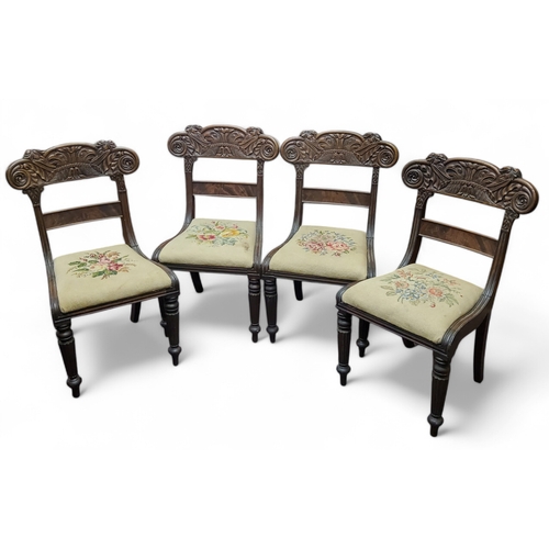 637 - An unusual set of four William IV Anglo-Colonial dining chairs, carved with parrots and serpents to ... 