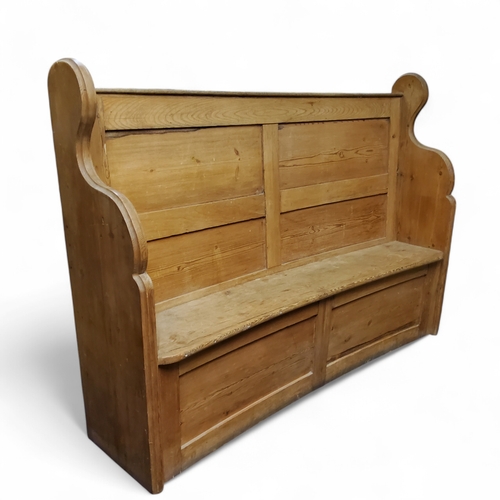 638 - A Victorian farmhouse pine bow backed settle, 126cm x 170cm x 38cm c.1880