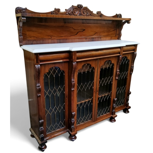 644 - An early 19th century rosewood breakfront chiffonier, the raised back with three quarter gallery, Ca... 