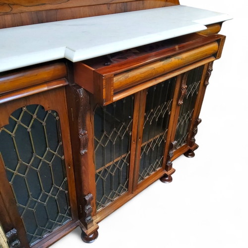 644 - An early 19th century rosewood breakfront chiffonier, the raised back with three quarter gallery, Ca... 