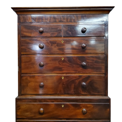 265 - A Regency flamed mahogany chest on chest, oversailing ogee cornice above two short over three gradua... 