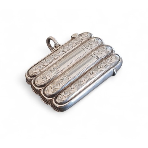 4 - An Edwardian silver novelty vesta case, in the form of a cigar case, gilt interior, chased and engra... 