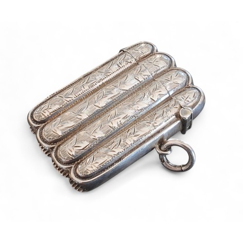 4 - An Edwardian silver novelty vesta case, in the form of a cigar case, gilt interior, chased and engra... 