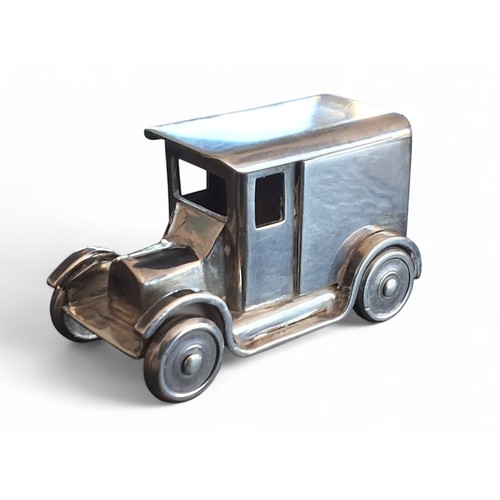 8 - An apprentice-piece white metal model loosely based on a Ford Model A panel van, rotating wheels, te... 