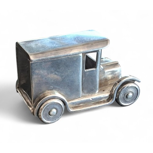 8 - An apprentice-piece white metal model loosely based on a Ford Model A panel van, rotating wheels, te... 