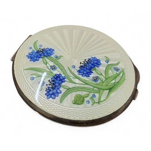 10 - A silver and guilloche enamel compact, the hinged cover hand painted with blue cornflowers and forge... 