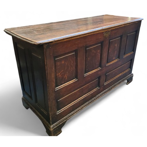 647 - An 18th century oak mule/blanket chest, four fielded panelled front above two faux drawer panels, br... 