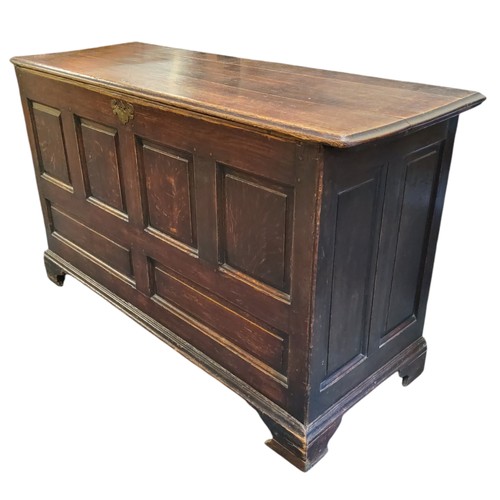 647 - An 18th century oak mule/blanket chest, four fielded panelled front above two faux drawer panels, br... 