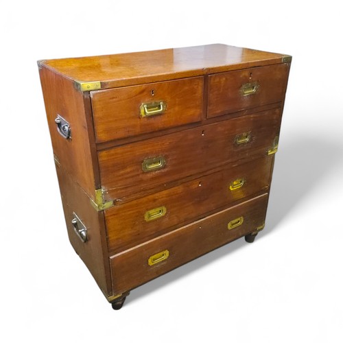 351 - A mid Victorian mahogany campaign chest of drawers, two short above three long, each inset recessed ... 